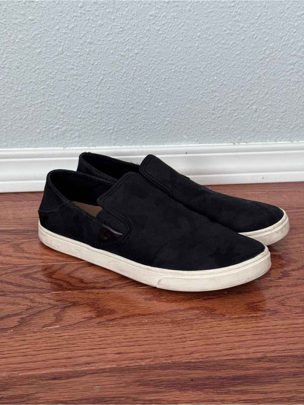 Women's OluKai Pehuea Black Slip-On Sneakers